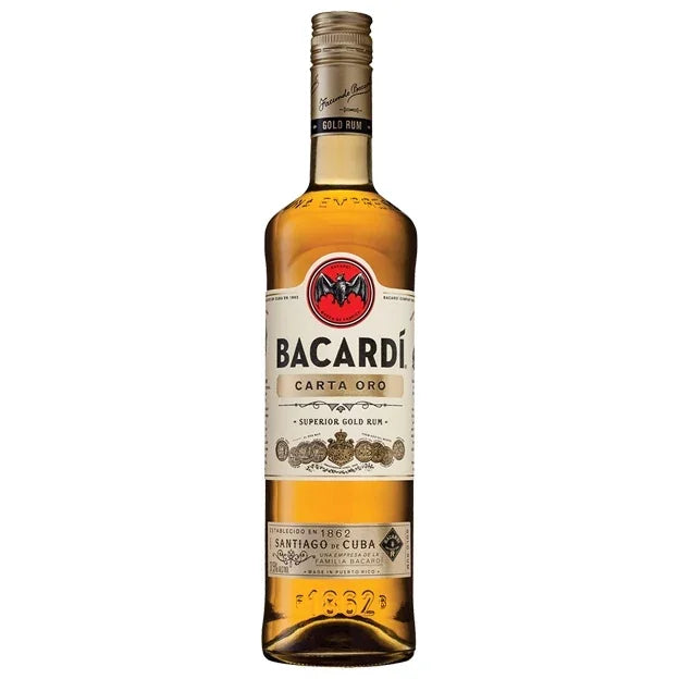 Bacardi Carta Oro gold rum bottle with label and bat logo on a white background