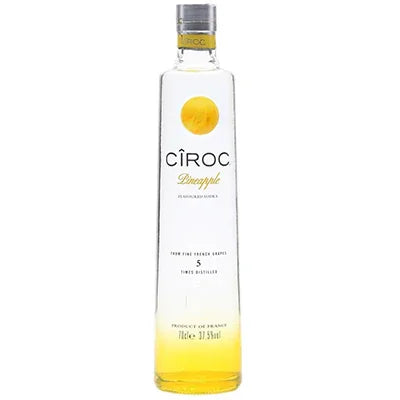 Ciroc Pineapple vodka bottle with yellow accents, premium spirits product photography.
