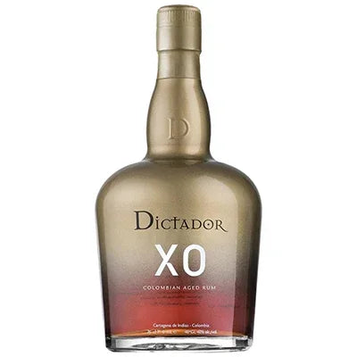 Gold and brown bottle of XO Colombian aged rum with Dictador label, isolated on white