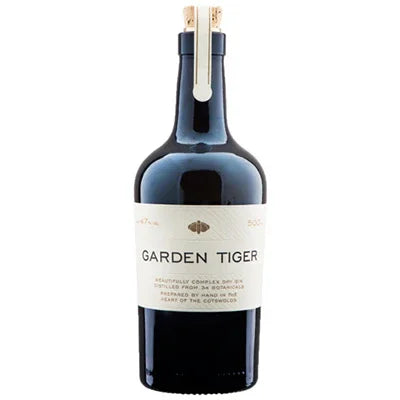 Garden Tiger gin bottle with cream label, dark glass, and wooden cap, premium spirits