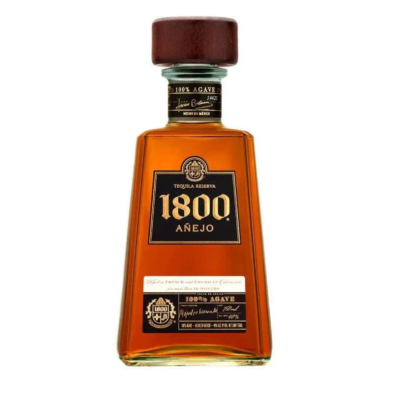 1800 Añejo Tequila bottle with amber liquid and wooden cap on white background