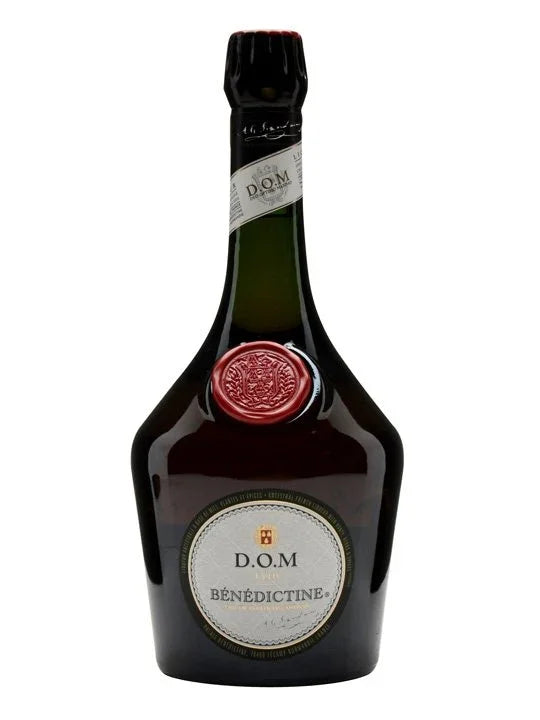 Benedictine D.O.M liqueur bottle with embossed red seal and label on white background