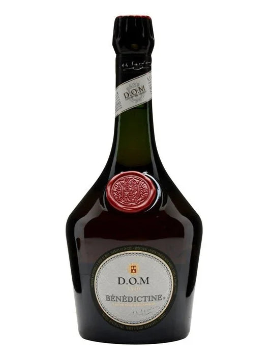 Benedictine D.O.M liqueur bottle with embossed red seal and label on white background