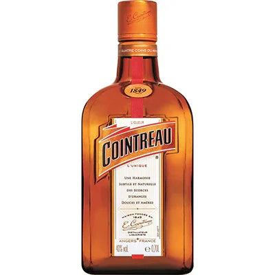 Cointreau liqueur bottle with orange glass and label, premium spirits product
