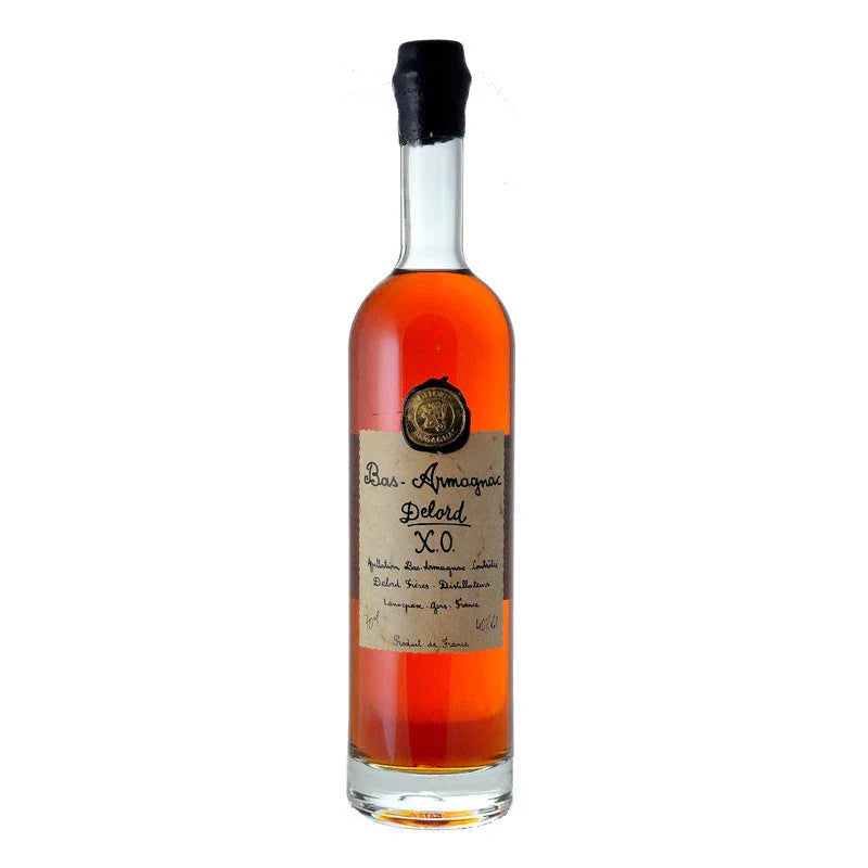 Bas-Armagnac XO bottle with amber liquor and gold label on white background