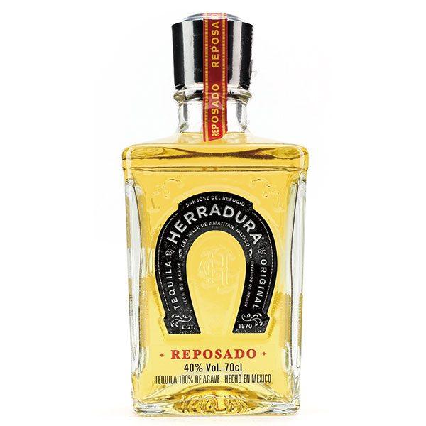 Herradura Reposado tequila bottle with black label and gold liquid, 700ml, agave spirit