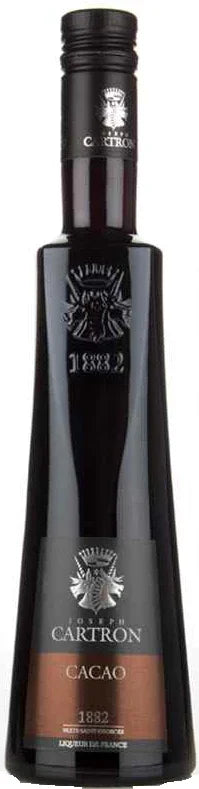 Tall dark glass bottle of cacao liqueur with embossed logo and brown label