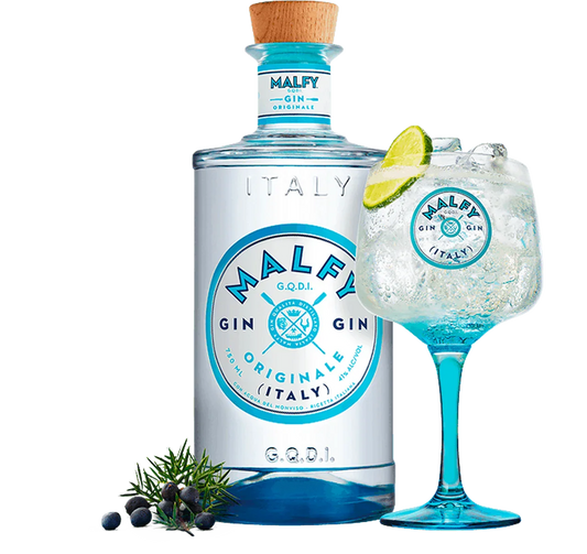 Malfy Originale gin bottle with branded cocktail glass, juniper berries, and lime garnish