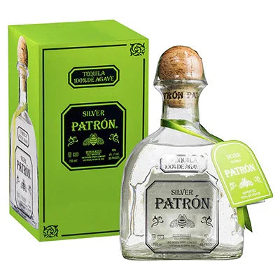 Patron Silver tequila bottle and box, clear glass, cork top, green packaging, 100% agave