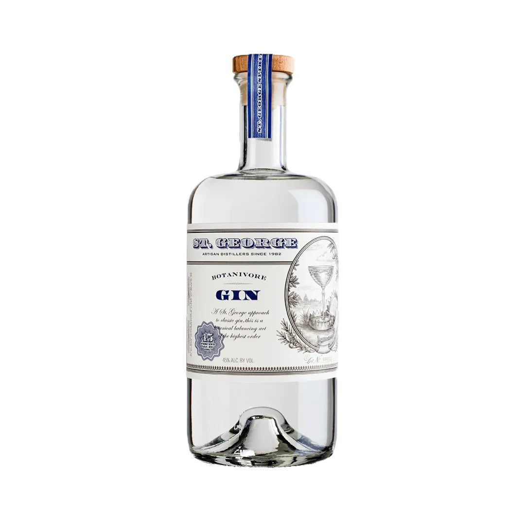Clear glass bottle of Botanivore gin with blue and white label, wooden cap, isolated on white.