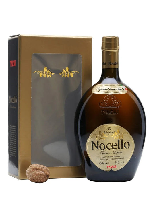 Nocello walnut liqueur bottle with gold box and a whole walnut on white background