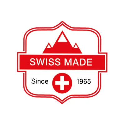 Red and white Swiss Made badge with mountain, cross symbol, and 'Since 1965' text